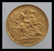 A 1911 half sovereign from the London Mint with a George and dragon design and a left facing king