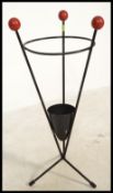 A vintage / retro 20th Century atomic stick stand, constructed from metal with ball finial feet.