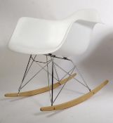 A vintage 1950's style RAR rocking chair after Charles and Ray Eames, with a plastic moulded seat on