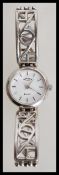 A ladies sterling silver rotary elite watch with a round white enamel chapter ring with stick