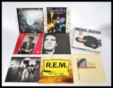 VINYL RECORDS - A collection of vinyl long pay LP records to include several artists such as The