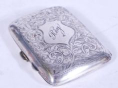 An early 20th century silver hinged cigarette case having fauna engraving to the case and initials