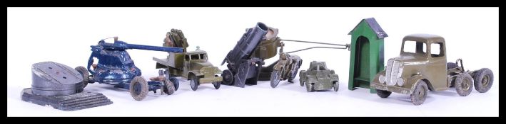 A collection of vintage die-cast model war/ army trucks and toys including a model motor bike, tank,