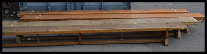 A group of four vintage Industrial  20th century gymnasium school benches of typical form having
