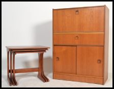 A retro 20th Century teak wood bureau, fall front with fully appointed interior over single drawer