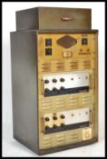 A vintage retro 20th century Rediffusion large record cabinet valve amplifier having a Garrard