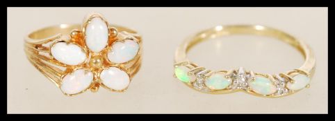 Two 9ct gold and opal rings to include a 9ct Sheffield hallmarked gold ring with five opals set into