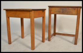 A pair of vintage circa 1950's single beech wood school desks, each fitted with a pair of flip top