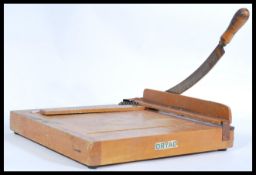 A vintage early 20th century oak school / industrial guillotine on wooden base with metal mounts and