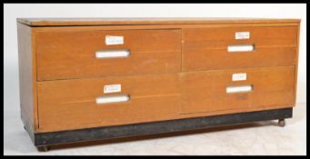 A vintage 20th Century four drawer beech wood architects industrial plan chest of drawers having