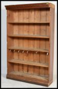 A 19th century Victorian oak open bookcase having shaped cornice with four removable shelves.