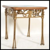 A vintage 20th century side occasional table having a gilt metal base with scroll work and