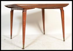 A mid 20th Century teak wood Danish inspired  extendable dining table raised on tapering supports,