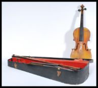 A 19th century cased violin with two bows one with horse hair with both having mother of pearl inlay