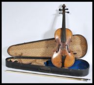 A 19th century Victorian walnut violin with a horse hair bow with mother of pearl inlay to the frog,