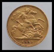 A half sovereign dating from 1902 depicting Edward VII right facing design with George and dragon