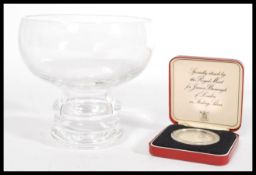 A James Burrough specially struck Royal Mint silver proof coin in case with capsule along with a