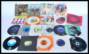 A group of vintage 20th century 45rpm vinyl records singles to include Trojan Hot Shot Upsetters