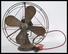 A vintage retro 1930's Art Deco GEC black metal industrial office fan having copper blades with