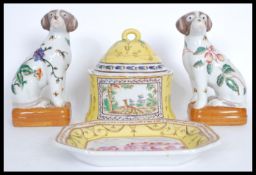 A group of 20th century Chinese ceramics to include a pair of fire side dogs decorated with peaches,