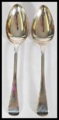 A pair of silver hallmarked Georgian basting table spoons in the Old English pattern bearing