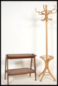 A vintage 20th century retro teak wood trolley of angular form along with a bentwood light Thonet