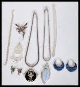 A collection of contemporary silver jewellery to include a paid of silver and agate hoop earrings,