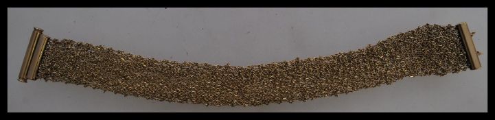 A contemporary Italian designer 9ct gold bracelet stamped 375 including a mesh linked gold band