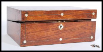 A 19th century mahogany writing slope box with inlaid mother of pearl, a green valor writing