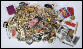 A collection of vintage costume jewellery to include a Chinese jade bangle with hinge opening, a