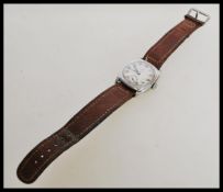 A vintage 1960's Omega Wearne wrist watch with roman numeral dial markings and a subsidiary sub dial
