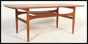 A vintage retro 1960's/70's teak rectangular coffee table with rounded edges, having a blue tiled
