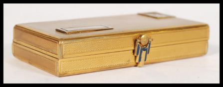 A vintage retro mid 20th century Zelma brass compact with an Art Deco style clasp including a hinged
