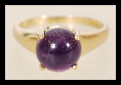 A hallmarked 9ct gold ring with a circular cobalt stone item weighs 3.8 grams hallmarked