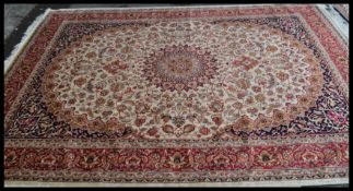 A large  vintage Persian floor carpet Keshan rug having a Beige ground with geometric borders and