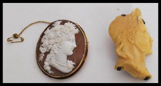 Two cameo brooches to include one male figure with a signature 'Zerorne' and a female figure with