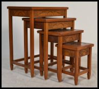 A 20th century Oriental Chinese hardwood quartetto nest of four graduating tables. each having