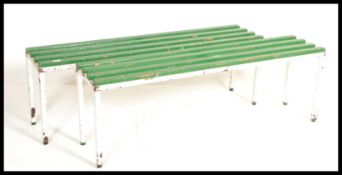 A pair of vintage 20th century Lilo / Tennis sports benches, raised on a metal tubular frame