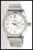 A vintage mid 20th century Tudor oyster prince self winding watch.  The watch includes a cream