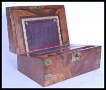 A 19th century Victorian walnut and brass bounded writing slope box having a brass escutcheon. The