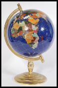 A vintage 20th century large Lapis Lazuli desk top globe raised on a stepped circular base with