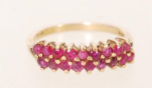 A hallmarked 9ct gold and ruby cluster ring. Hallm