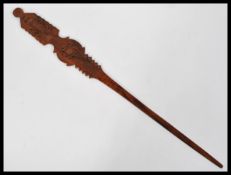 An olive wood Judacia page turner for the Torah having carved pierced geometric decoration circa