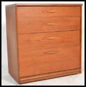 A vintage retro 20th century teak chest of drawers by Austinsuite London. The straight bank of