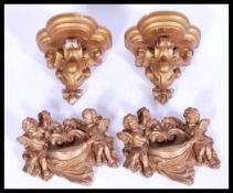A collection of plaster gold painted wall plaques