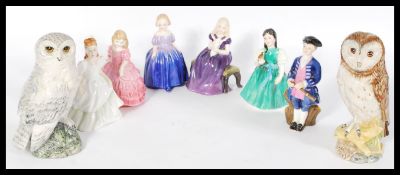 A group of seven Royal Doulton ceramic figures to