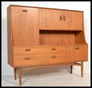 A 20th century vintage retro Sienna G-Plan highboa