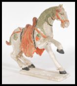 A Chinese Tang dynasty style ceramic figurine of a
