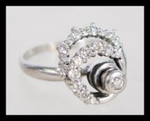 A vintage 20th century diamond and white metal sta