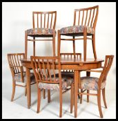 A retro teak wood danish inspired dining suite, ex